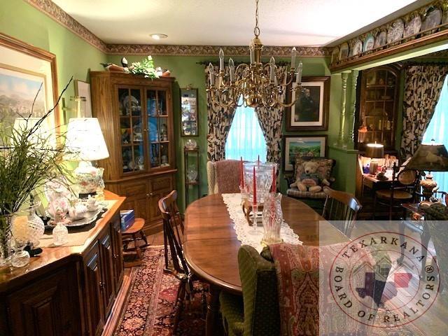 dining area featuring a notable chandelier