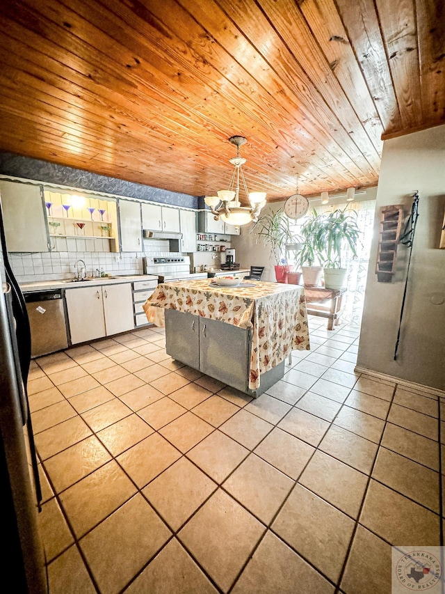 kitchen featuring hanging light fixtures, sink, white cabinets, wood ceiling, and light tile patterned flooring