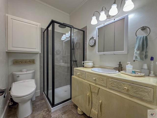 full bath featuring toilet, a stall shower, vanity, and ornamental molding