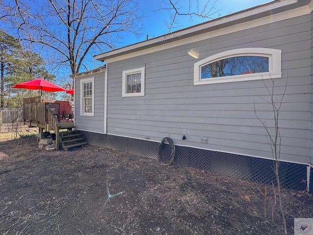 view of property exterior featuring a deck