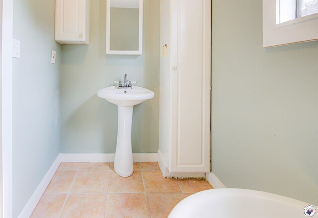 1920 Laurel St, Texarkana, AR 71854 - bathroom featuring tile patterned flooring, baseboards, and a sink