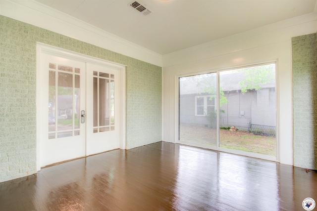 1920 Laurel St, Texarkana, AR 71854 - spare room with french doors, wood finished floors, and crown molding