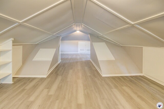 1920 Laurel St, Texarkana, AR 71854 - bonus room featuring wood finished floors, vaulted ceiling, and baseboards