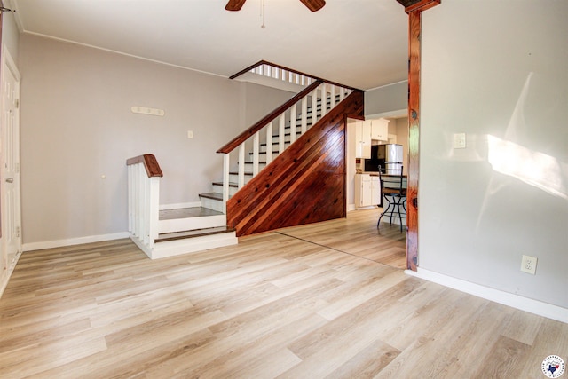 1920 Laurel St, Texarkana, AR 71854 - staircase with wood finished floors, ceiling fan, and baseboards
