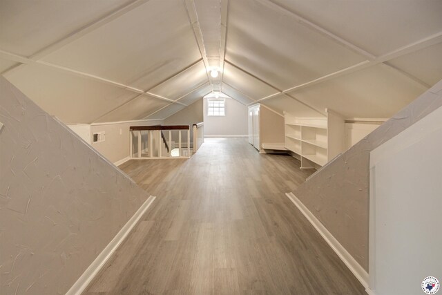 1920 Laurel St, Texarkana, AR 71854 - additional living space with wood finished floors, baseboards, and vaulted ceiling