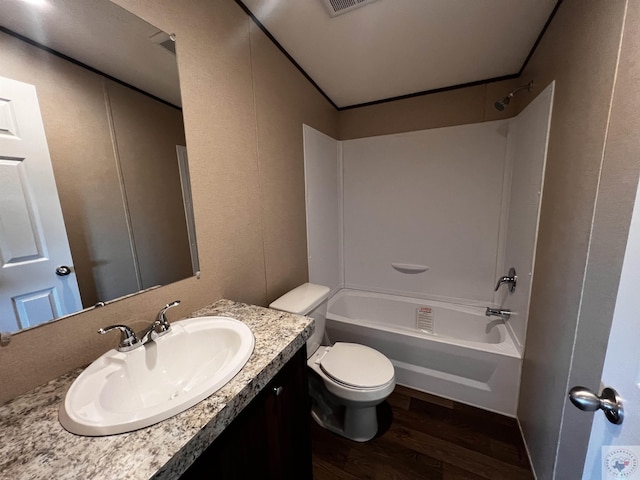 2 Rayn St, Texarkana, TX 75501 - full bath featuring toilet, tub / shower combination, wood finished floors, and vanity