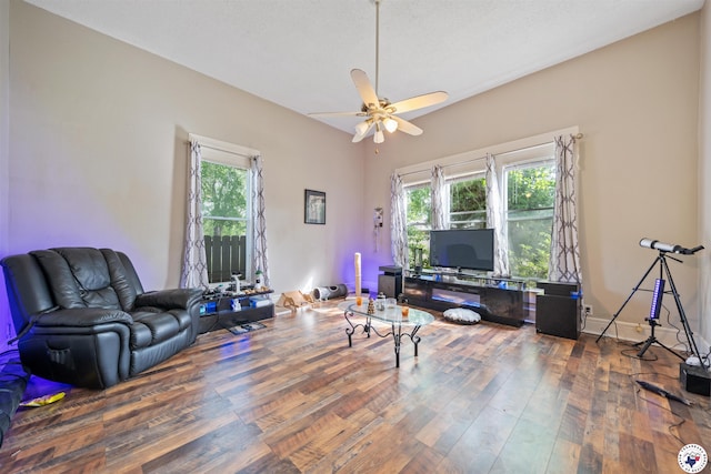 living area with ceiling fan and wood finished floors