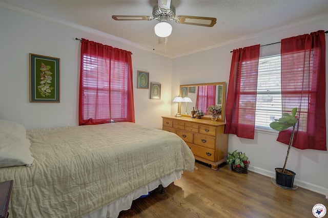 3916 Sabine Ave, Texarkana, TX 75503 - bedroom with wood finished floors, ornamental molding, baseboards, and a ceiling fan