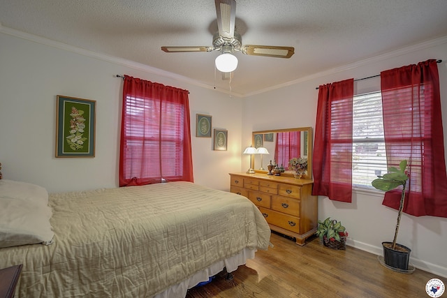 3916 Sabine Ave, Texarkana, TX 75503 - bedroom with wood finished floors, crown molding, baseboards, and ceiling fan