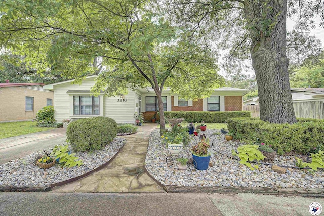 3916 Sabine Ave, Texarkana, TX 75503 - view of property hidden behind natural elements with brick siding