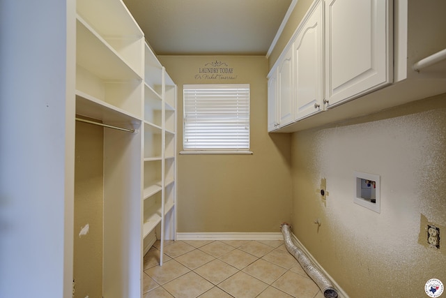 laundry area with light tile patterned floors, gas dryer hookup, hookup for a washing machine, baseboards, and electric dryer hookup