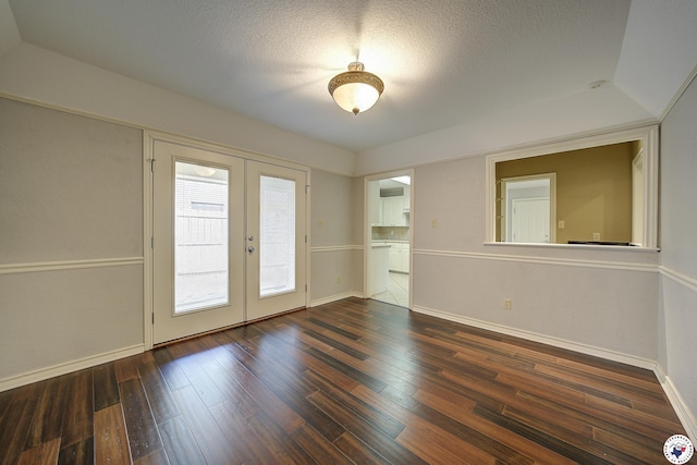 4 Heatherwood Dr, Texarkana, TX 75503 - unfurnished room with a textured ceiling, hardwood / wood-style floors, baseboards, and french doors