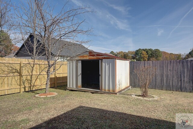 view of outdoor structure featuring a lawn