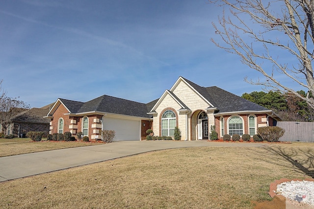 view of front facade with a garage and a front yard