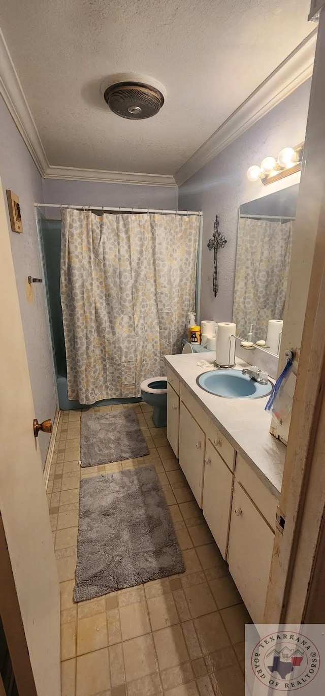 full bathroom featuring ornamental molding, shower / tub combo, vanity, and a textured ceiling