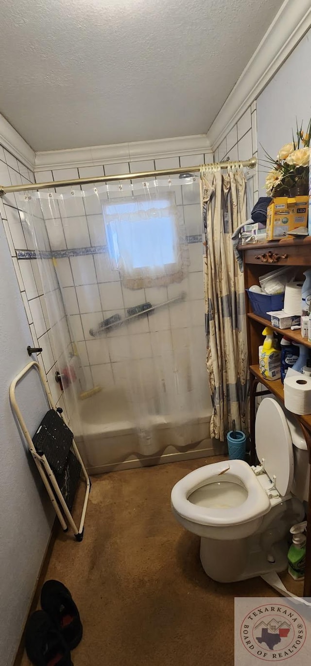 bathroom featuring shower / bath combination with curtain, toilet, a textured ceiling, and crown molding