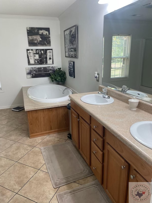 bathroom with crown molding, tile patterned flooring, a tub to relax in, and vanity