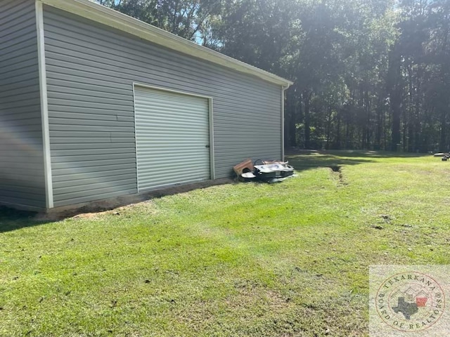 garage featuring a lawn