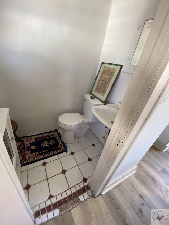 bathroom featuring sink and toilet