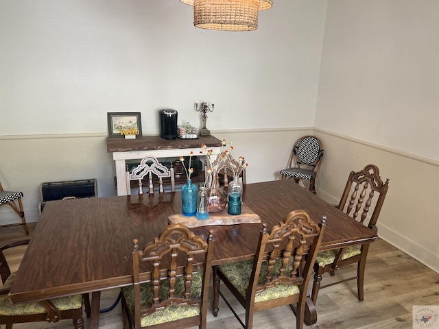 dining room with wood-type flooring