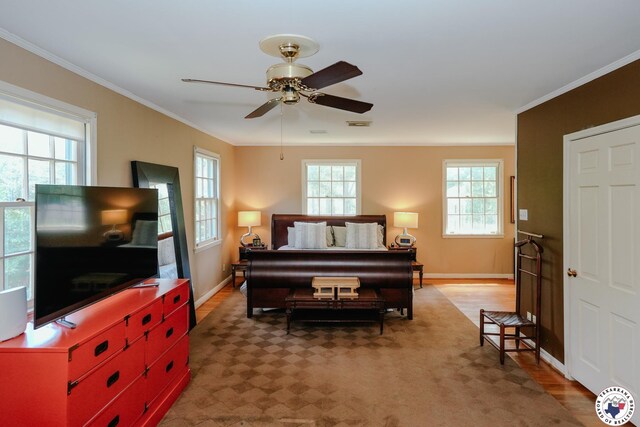 3519 Olive St, Texarkana, TX 75503 - bedroom featuring crown molding, light wood-type flooring, baseboards, and ceiling fan