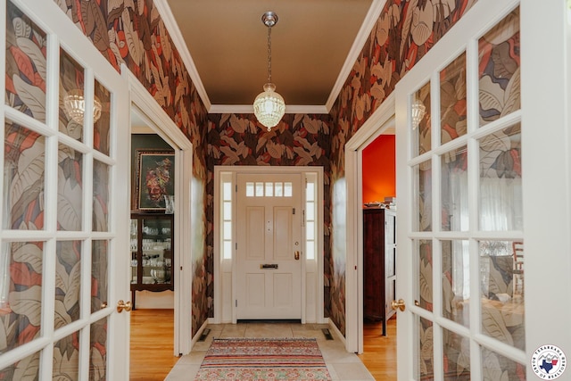 3519 Olive St, Texarkana, TX 75503 - entryway with wallpapered walls, crown molding, and french doors