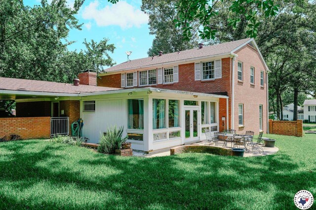 3519 Olive St, Texarkana, TX 75503 - rear view of property featuring a patio, a lawn, brick siding, and a chimney