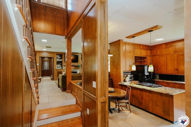 3519 Olive St, Texarkana, TX 75503 - kitchen featuring freestanding refrigerator, stainless steel gas cooktop, light tile patterned floors, and decorative backsplash