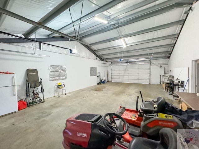 garage featuring white fridge