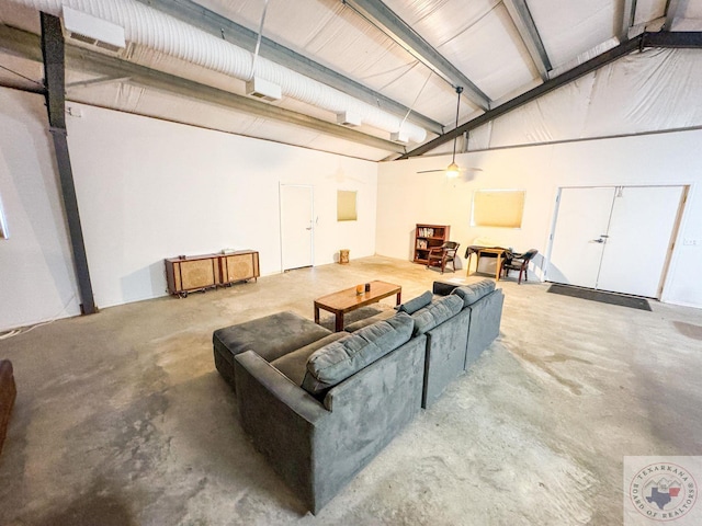 living room with concrete flooring and ceiling fan