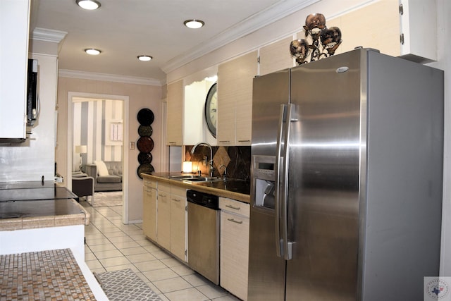 kitchen with light tile patterned floors, sink, white cabinets, and appliances with stainless steel finishes