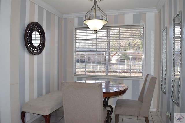 dining space featuring tile patterned flooring and ornamental molding