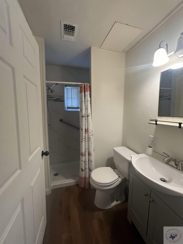 bathroom with hardwood / wood-style flooring, toilet, vanity, and a shower with shower curtain