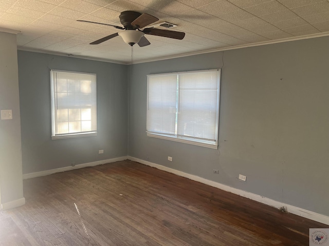 unfurnished room with ceiling fan, crown molding, and dark hardwood / wood-style floors