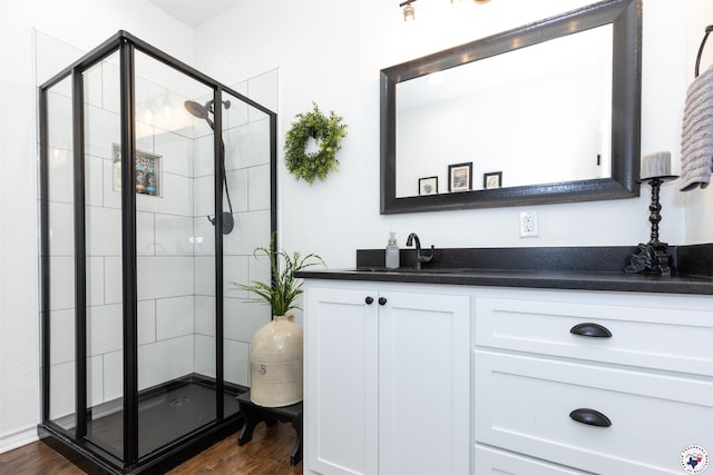 113 Dove Crk, New Boston, TX 75570 - full bathroom featuring vanity, a stall shower, and wood finished floors