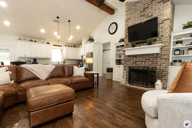 113 Dove Crk, New Boston, TX 75570 - living room with dark wood finished floors, a fireplace, beamed ceiling, high vaulted ceiling, and recessed lighting