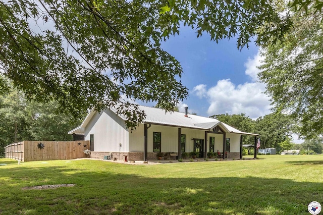 113 Dove Crk, New Boston, TX 75570 - rear view of property featuring a metal roof