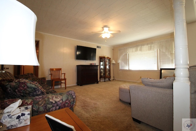 living room featuring ceiling fan and carpet