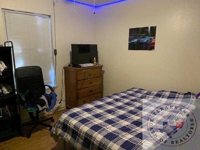 bedroom featuring light wood-type flooring