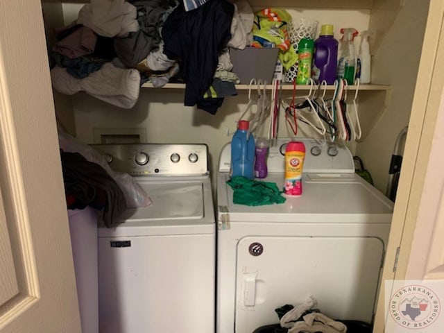 clothes washing area with washer and dryer