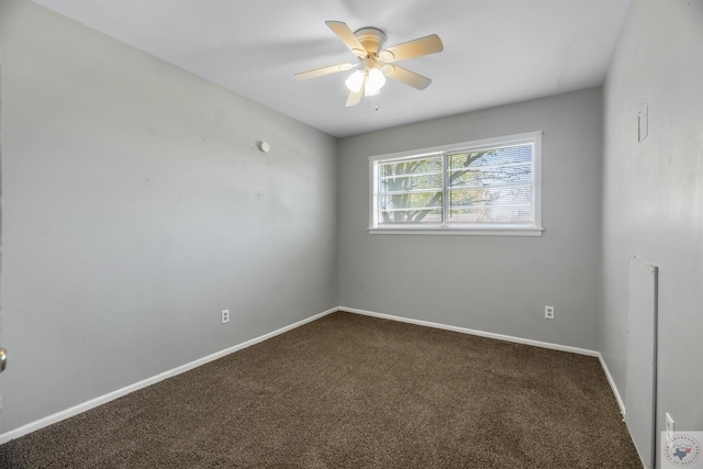 unfurnished room with ceiling fan and carpet