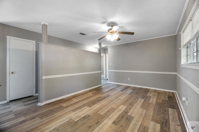 interior space featuring hardwood / wood-style floors, ceiling fan, and ornamental molding