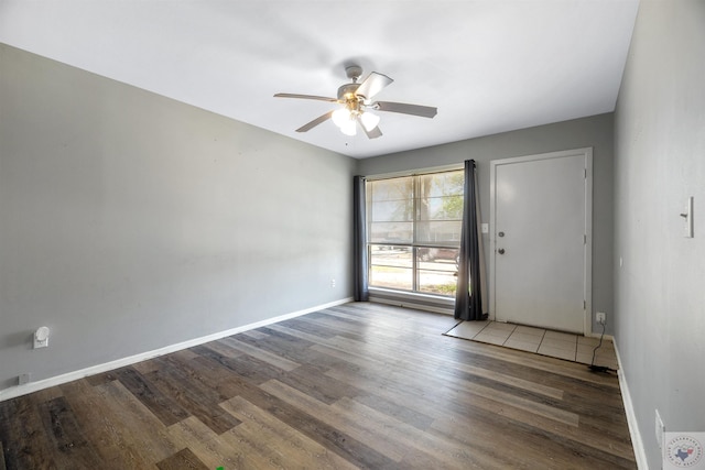 unfurnished room featuring ceiling fan and wood-type flooring