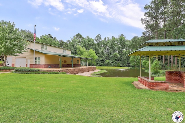 142 Easy St, Texarkana, TX 75503 - view of green lawn with a water view, a garage, and a gazebo