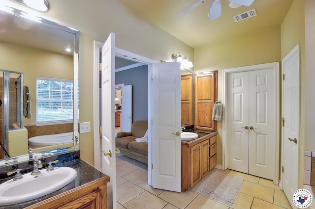 142 Easy St, Texarkana, TX 75503 - bathroom with vanity, tile patterned floors, a bath, ceiling fan, and a stall shower