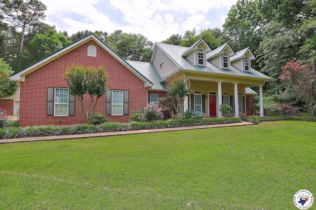 142 Easy St, Texarkana, TX 75503 - cape cod house with a front yard, brick siding, metal roof, and a porch