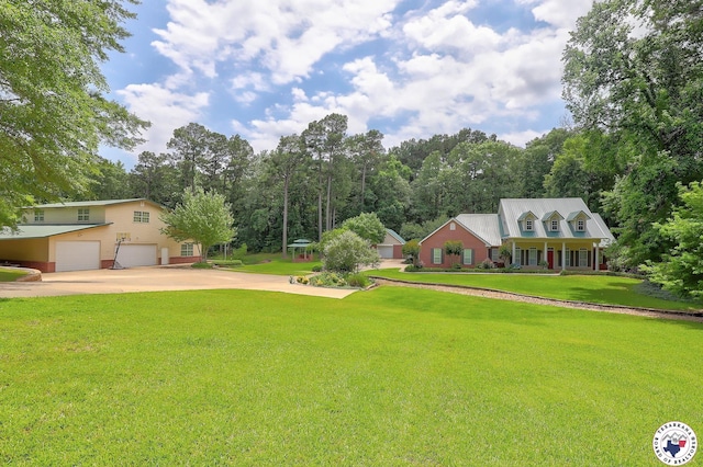 142 Easy St, Texarkana, TX 75503 - view of green lawn with a garage and driveway
