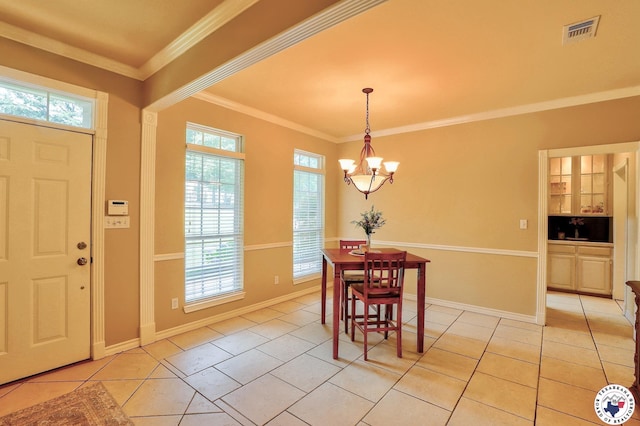 142 Easy St, Texarkana, TX 75503 - dining area with a chandelier, healthy amount of natural light, light tile patterned floors, ornamental molding, and baseboards