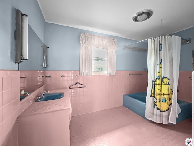 3223 Walnut St, Texarkana, TX 75503 - bathroom with vanity, shower / bathtub combination with curtain, tile walls, and wainscoting