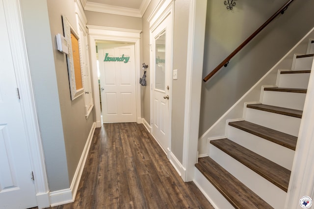 doorway to outside with crown molding, baseboards, dark wood finished floors, and stairway
